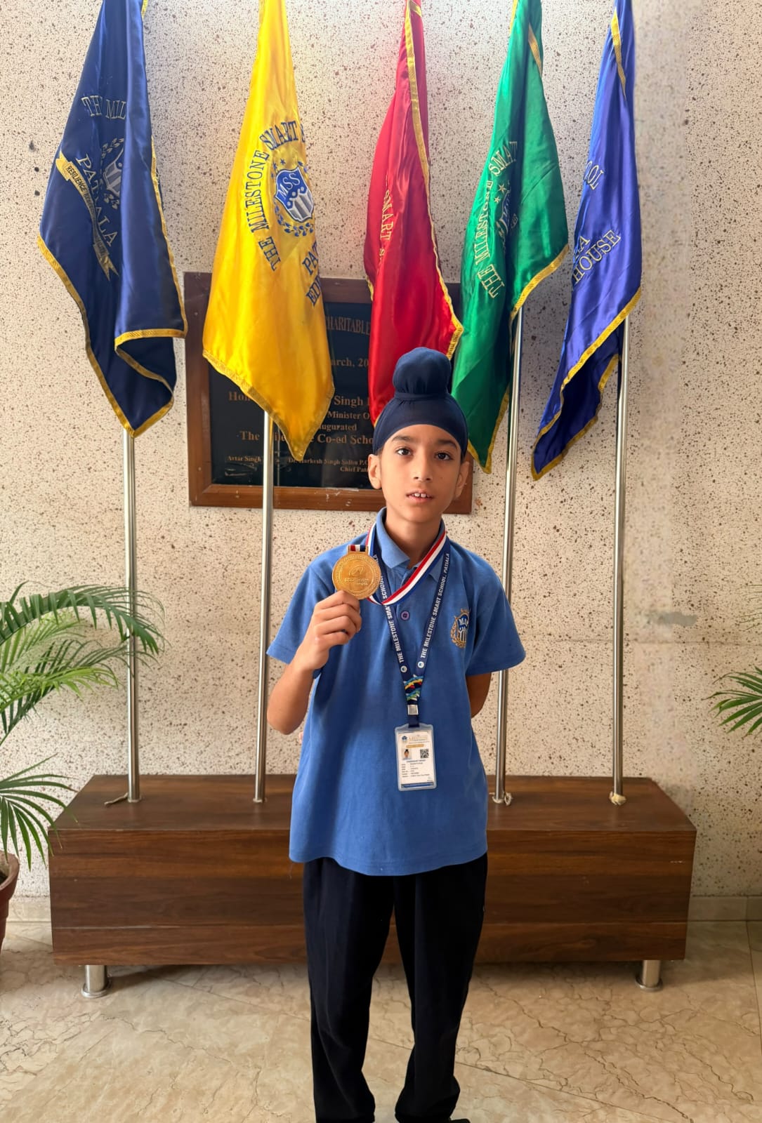 Charanjot Singh of Grade V displaying his skating championship medal
