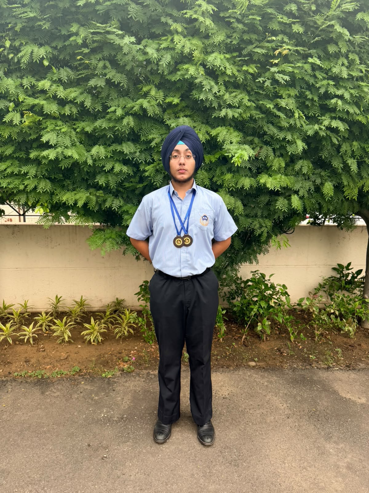 Santparkash of Grade XI celebrating his wrestling achievement